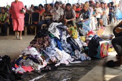 PARTICIPANTS WAIT IN LINE TO GET FREE CLOTHES