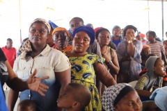 PARTICIPANTS WAIT IN LINE TO GET FREE CLOTHES