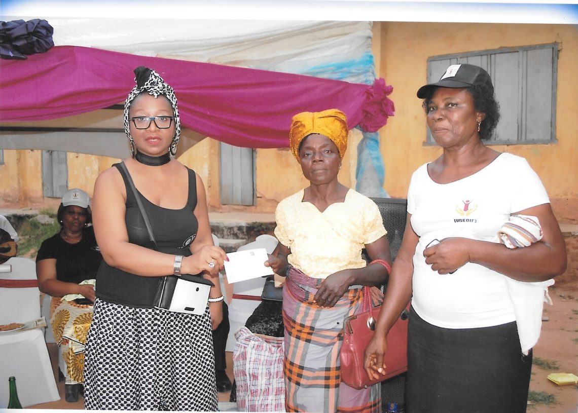 Another beneficiary receiving her cheque