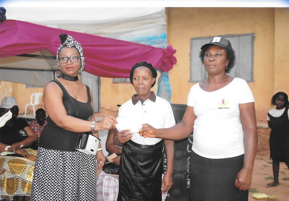 Another beneficiary receiving her cheque